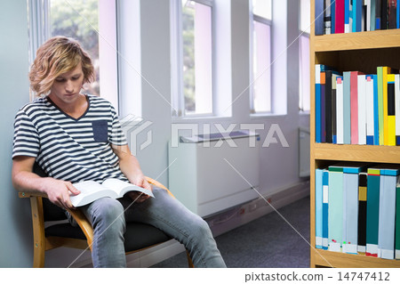 Student reading in library Student reading in library 14747412