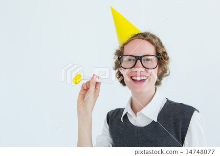 Geeky hipster in party hat with horn Geeky hipster in party hat with horn 14748077