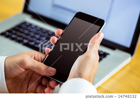 Man using laptop and smartphone 14748132