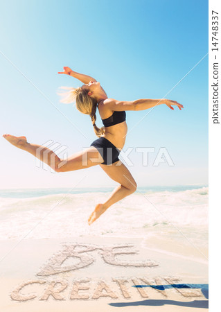 Composite image of fit blonde jumping gracefully on the beach Composite image of fit blonde jumping gracefully on the beach 14748337