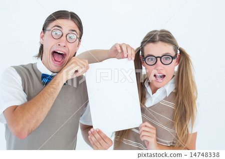Geeky hipsters holding a poster Geeky hipsters holding a poster 14748338