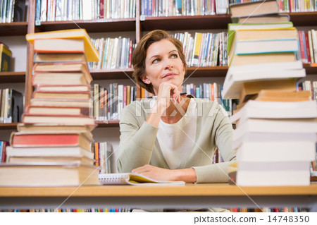 Thoughtful teacher at library 14748350