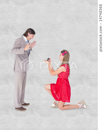 Composite image of pretty hipster on bended knee doing a marriag 14748568