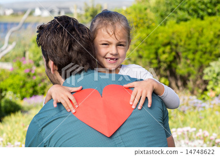 Daughter giving dad a heart card 14748622