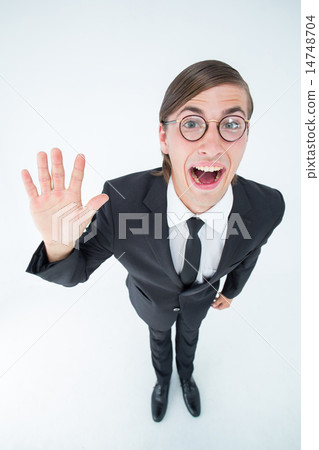 Geeky businessman waving at camera 14748704