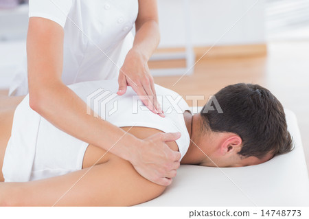Physiotherapist doing back massage 14748773