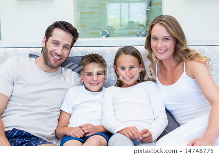 Happy family smiling at camera 14748775