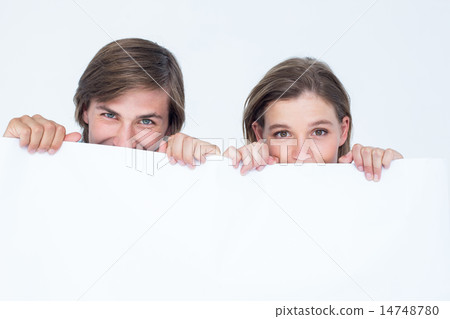 Hipster couple holding poster 14748780