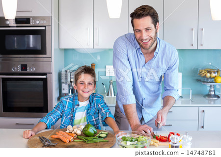 Happy family preparing lunch together Happy family preparing lunch together 14748781