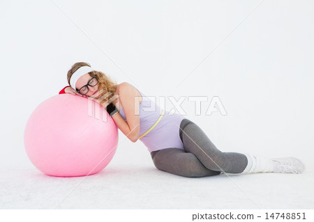 Geeky hipster resting on fitness ball 14748851