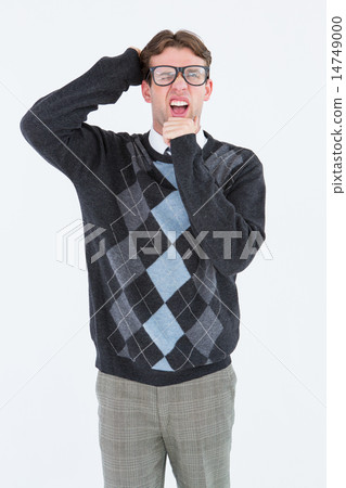 Geeky hipster frowning at camera Geeky hipster frowning at camera 14749000