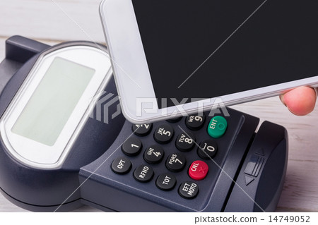 Man using smartphone to express pay 14749052