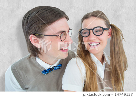 Composite image of geeky hipster couple smiling at each other 14749137