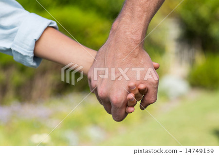 Father and son holding hands Father and son holding hands 14749139