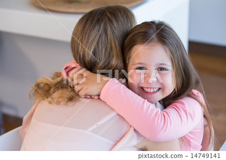 Father and daughter hugging Father and daughter hugging 14749141