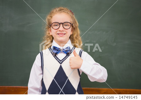 Happy pupil looking at camera with thumb up Happy pupil looking at camera with thumb up 14749145