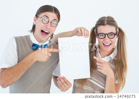 Geeky hipsters pointing at poster 14749275