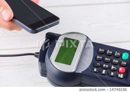 Man using smartphone to express pay Man using smartphone to express pay 14749286
