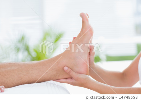 Physiotherapist doing foot massage 14749558