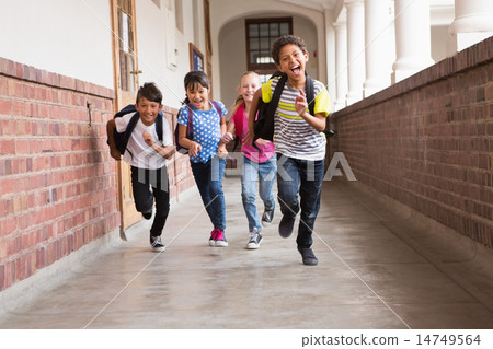 Cute pupils running down the hall Cute pupils running down the hall 14749564