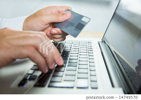 Man using laptop for online shopping Man using laptop for online shopping 14749570
