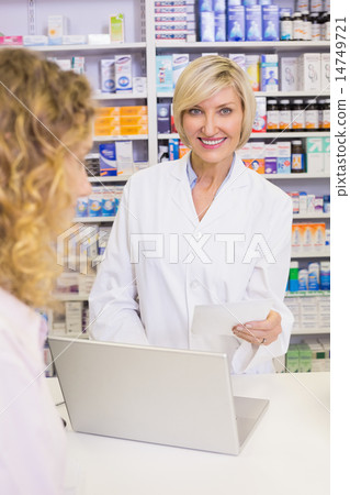 Pharmacist using the computer 14749721