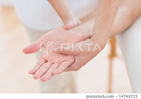 Physiotherapist doing hand massage 14749725