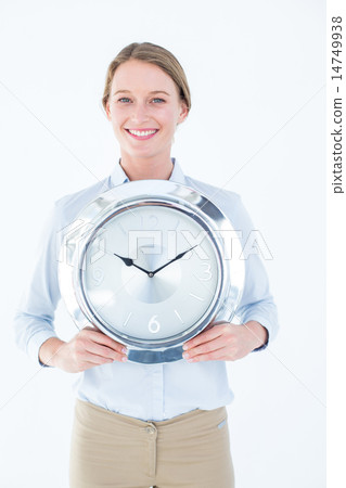 Businesswoman in suit holding a clock 14749938