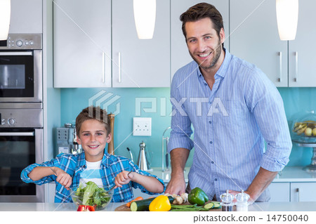 Happy family preparing lunch together Happy family preparing lunch together 14750040