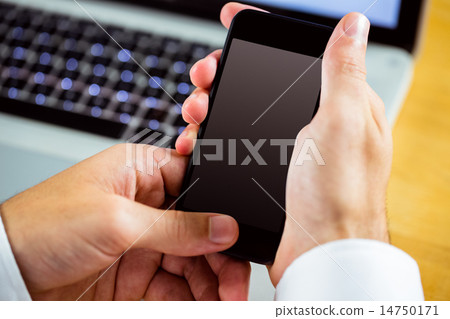 Man using laptop and smartphone 14750171