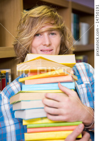 Student smiling at camera in library Student smiling at camera in library 14750191