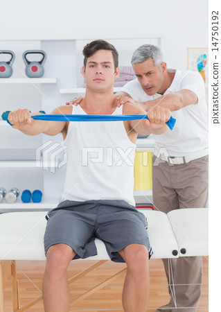 Doctor examining his patient back Doctor examining his patient back 14750192
