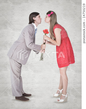 Composite image of cute geeky couple kissing 14750219