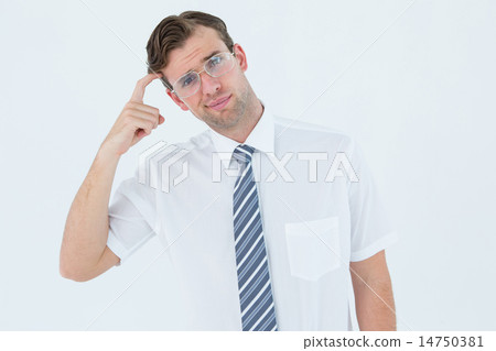 Geeky businessman thinking with finger on temple 14750381