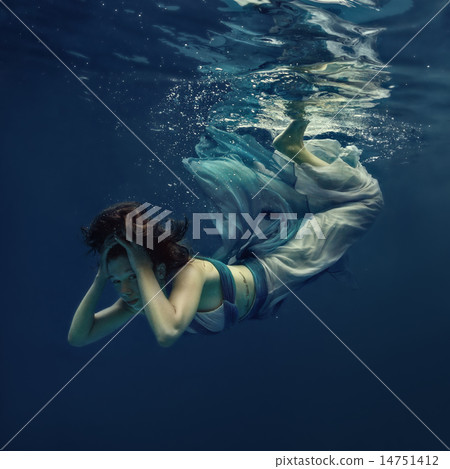 The girl in a beautiful dress under water. 14751412