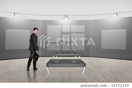 Businessman in gallery room 14752234