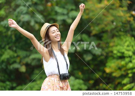 Young Chinese rising hands in the air 14753958