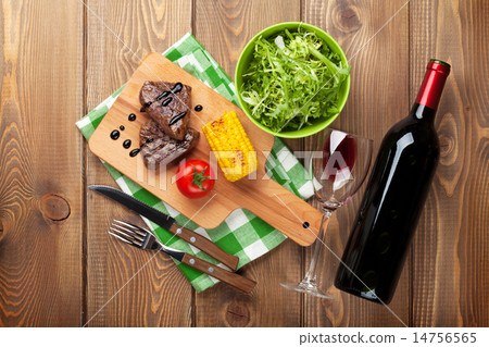 Steak with grilled corn, salad and red wine Steak with grilled corn, salad and red wine 14756565