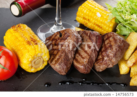 Steak with grilled potato, corn, salad and wine Steak with grilled potato, corn, salad and wine 14756573