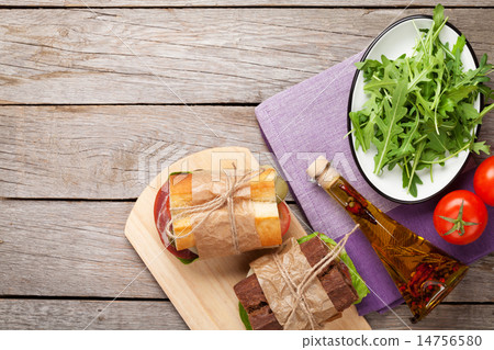 Two sandwiches with ham, cheese and tomatoes Two sandwiches with ham, cheese and tomatoes 14756580