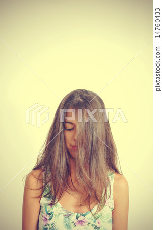 young brunette woman with her eyes closed 14760433