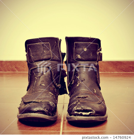 worn and torn boots 14760924