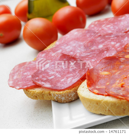 bread slices with spanish salchichon and chorizo 14761171