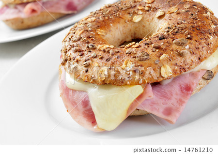 brown bagel filled with ham and cheese brown bagel filled with ham and cheese 14761210