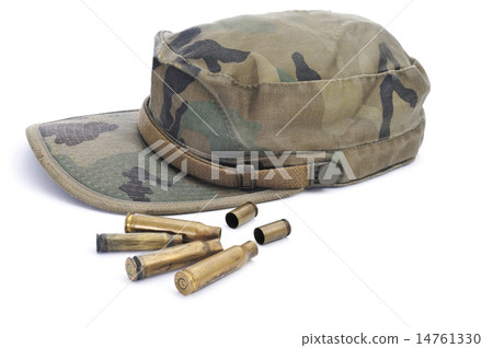 camouflage cap and empty bullets camouflage cap and empty bullets 14761330