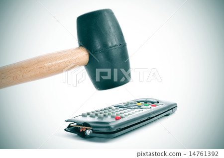 broking a remote control with a hammer 14761392
