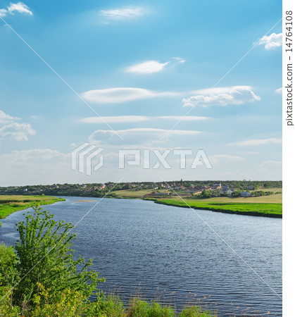 river with green riverside and light cloudy sky river with green riverside and light cloudy sky 14764108