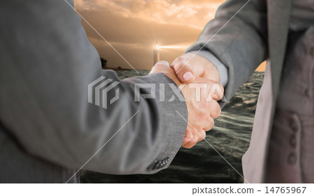 Composite image of business people shaking hands close up 14765967