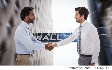 Composite image of smiling young businessmen shaking hands in of Composite image of smiling young businessmen shaking hands in of 14766016