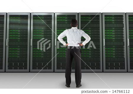 Composite image of businessman standing back to the camera with 14766112